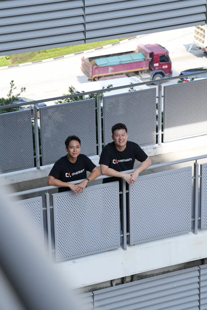 OneTeam HQ founder, smiling at the balcony